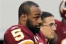 Washington Redskins quarterback Donovan McNabb stands on the sidelines before an NFL football game against the Dallas Cowboys, Sunday, Dec. 19, 2010, in Arlington, Texas. (AP Photo/Tim Sharp)