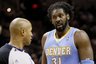 Denver Nuggets' Nene, right, of Brazil, talks to official Marc Davis during the second half of an NBA basketball game against the San Antonio Spurs, Wednesday, Dec. 22, 2010, in San Antonio. San Antonio won 109-103. (AP Photo/Darren Abate)