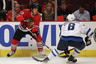 CHICAGO, IL - OCTOBER 13: Daniel Carcillo #13 of the Chicago Blackhawks controls the puck as Alexander Burmistrov #8 of the Winnipeg Jets closes in at the United Center on October 13, 2025 in Chicago, Illinois.  (Photo by Jonathan Daniel/Getty Images)