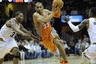 Mar 25, 2012; Cleveland, OH, USA; Phoenix Suns small forward Grant Hill (33) drives between Cleveland Cavaliers small forward Alonzo Gee (33) and point guard Kyrie Irving (2) in the second quarter at Quicken Loans Arena. Mandatory Credit: David Richard-US PRESSWIRE