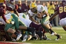 Minneapolis, MN, USA: North Dakota State Bisons quarterback Brock Jensen (16) runs for a one yard touchdown in the second quarter against the Minnesota Gophers at TCF Bank Stadium. Mandatory Credit: Jesse Johnson-US PRESSWIRE