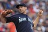 Seattle Mariners starting pitcher Cliff Lee throws against the Cincinnati Reds in the second inning during a baseball game  Friday, June 18, 2010, in Seattle. (AP Photo/Elaine Thompson)