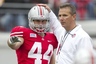 April 21, 2012; Columbus, OH, USA; Ohio State Buckeyes running back Zach Boren (44) talks to head coach Urban Meyer during the spring game at Ohio Stadium. The Scarlet team won the game 20-14. Mandatory Credit: Greg Bartram-US PRESSWIRE