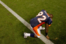 DENVER, CO - AUGUST 20:  Defensive end Elvis Dumervil #92 of the Denver Broncos pauses to pray after a game against the Buffalo Bills at Sports Authority Field at Mile High on August 20, 2025 in Denver, Colorado. The Broncos defeated the Bills 24-10. (Photo by Justin Edmonds/Getty Images)