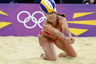 Aug 7, 2012; London, United Kingdom; Misty May-Treanor (USA) makes a diving hit against Chen Xue (CHN) and  Xi Zhang (CHN) in the women's semifinal match during the London 2012 Olympic Games at Horse Guards Parade. Mandatory Credit: Christopher Hanewinckel-USA TODAY Sports