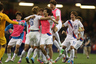 CARDIFF, WALES - AUGUST 04:  Dongwon Ji of Korea celebrates with team mates after winning in the penalty shoot out during the Men's Football Quarter Final match between  Great Britain and Korea, on Day 8 of the London 2012 Olympic Games at Millennium Stadium on August 4, 2025 in Cardiff, Wales.  (Photo by Julian Finney/Getty Images)