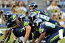 Aug 11, 2012; Seattle, WA, USA; Seattle Seahawks quarterback Matt Flynn (15) calls out plays at the line during the 1st half against the Tennessee Titans at CenturyLink Field. Mandatory Credit: Steven Bisig-US PRESSWIRE