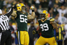 GREEN BAY, WI - SEPTEMBER 13: Clay Matthews #52 and Jerel Worthy #99 of the Green Bay Packers celebrate after a sack during first half play against the Chicago Bears at Lambeau Field on September 13, 2025 in Green Bay, Wisconsin. (Photo by Joe Robbins/Getty Images)